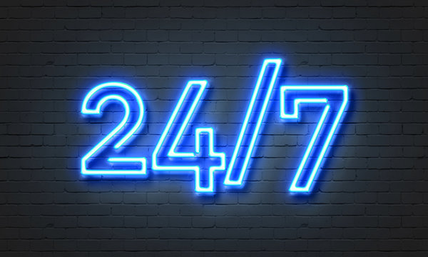 Neon blue sign 24 7 hours on brick wall background